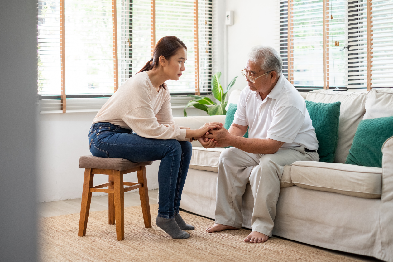 A woman speaks with her grandfather about his low mood